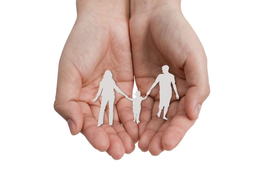 Hand with the paper cut of the family Hand with the paper cut of the family